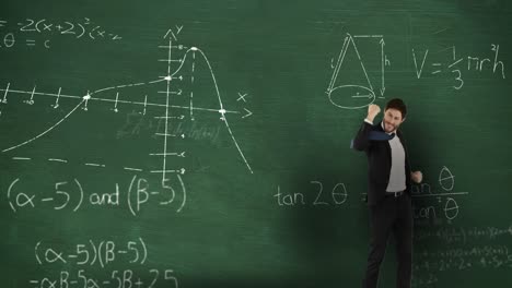 man in front of moving maths on blackboard