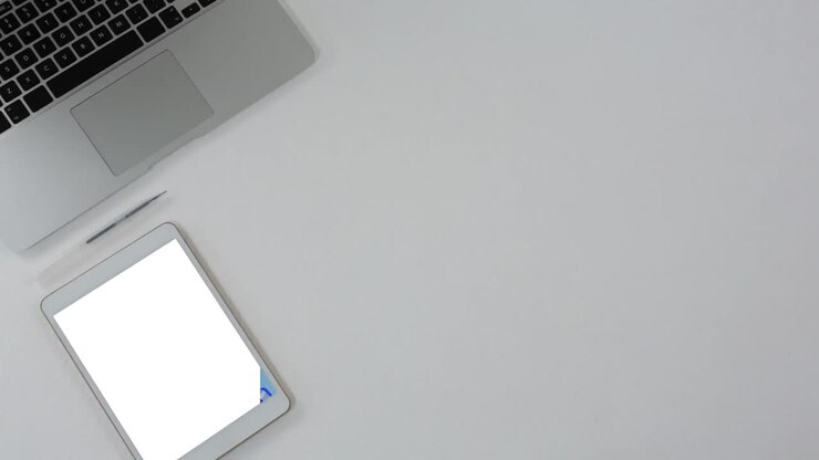 Video of tablet with blank screen and laptop with copy space on grey background