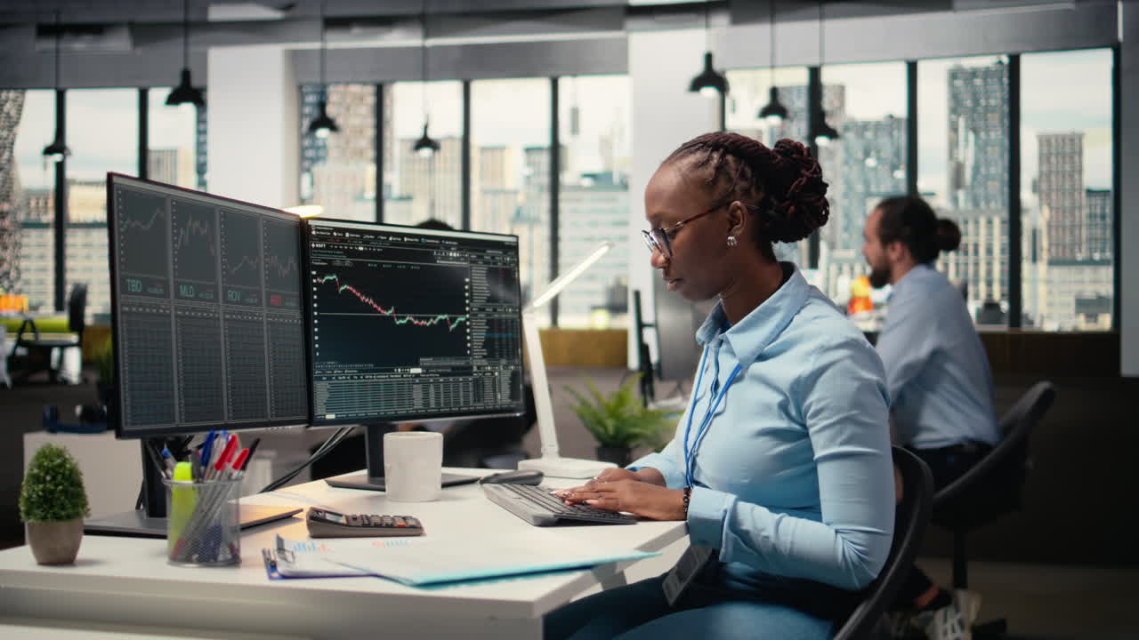 Day trader analyzes stock exchange price candlestick graphs