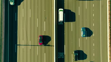 bird view of two lanes cars driving opposite direction various models different builds plenty lanes quick movement straight lines moving along van truck electric petrol hot san francisco california