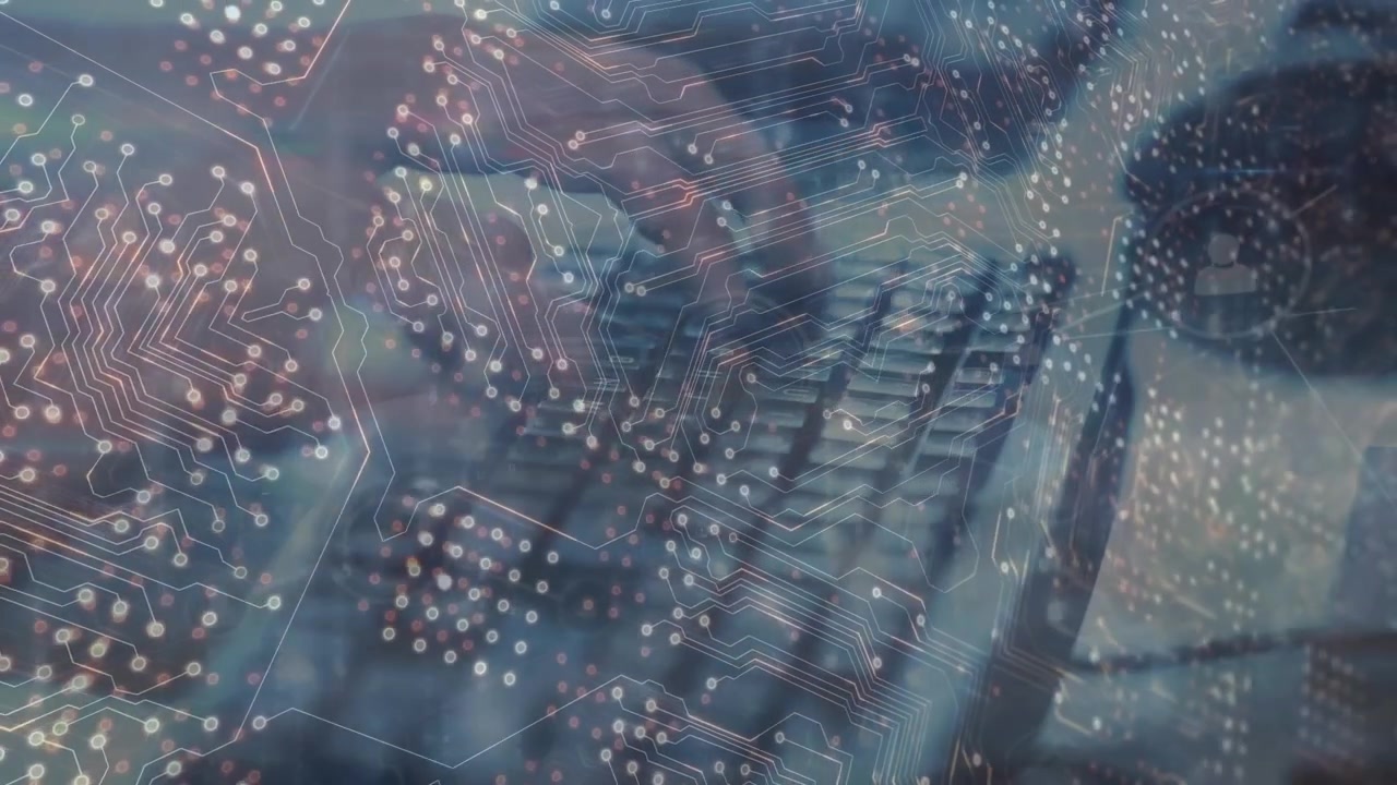 Animation of computer circuit board and network of connections over hands typing on keyboard