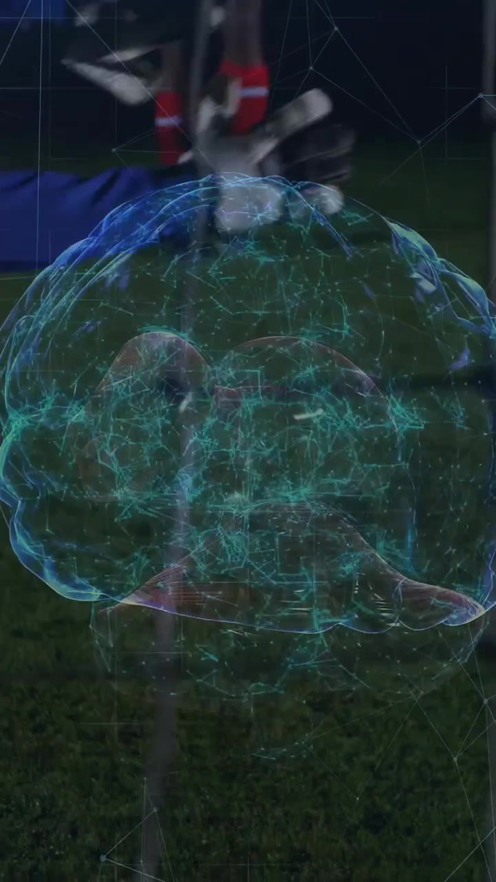 Vertical video: Player shooting to score brain holo over goal ball passing GK diving saving sports