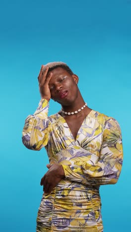 black transgender person suffering from headache. vertical 4k