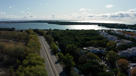 aerial view of a car in a resort town la grande motte pine trees and lake france