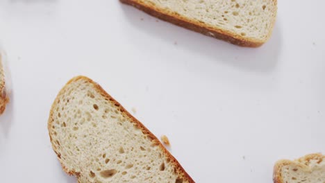 video of slices of bread seeing from above on white background