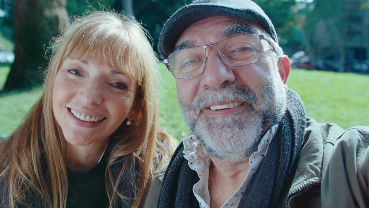 Happy Senior Couple Having Talk on Video Call in the Park