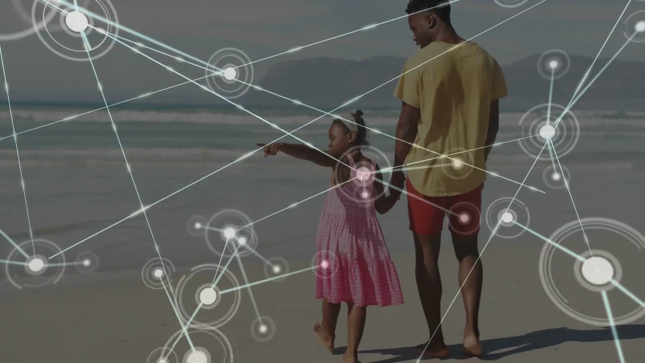Dad holding hand walking sand, her pointing at horizon exploring, sparking tech dots around pair