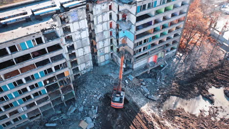 special machinery destroys old buildings. destruction of a building with special machine