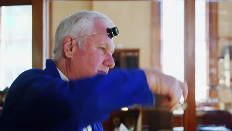 horologist repairing a watch