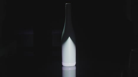 a light shines on a bottle