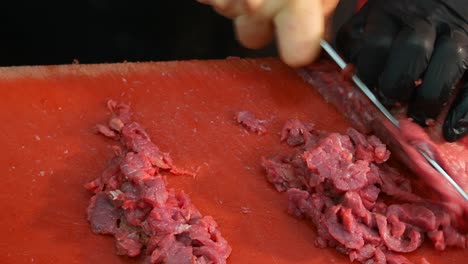 chef mincing raw beef