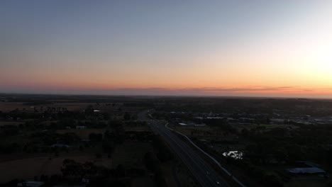drone shot at sunset over road