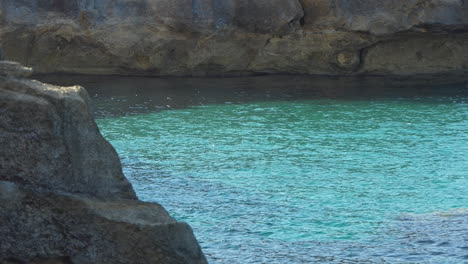 clear turquoise seawater in a cove or cala creek on the island of minorca