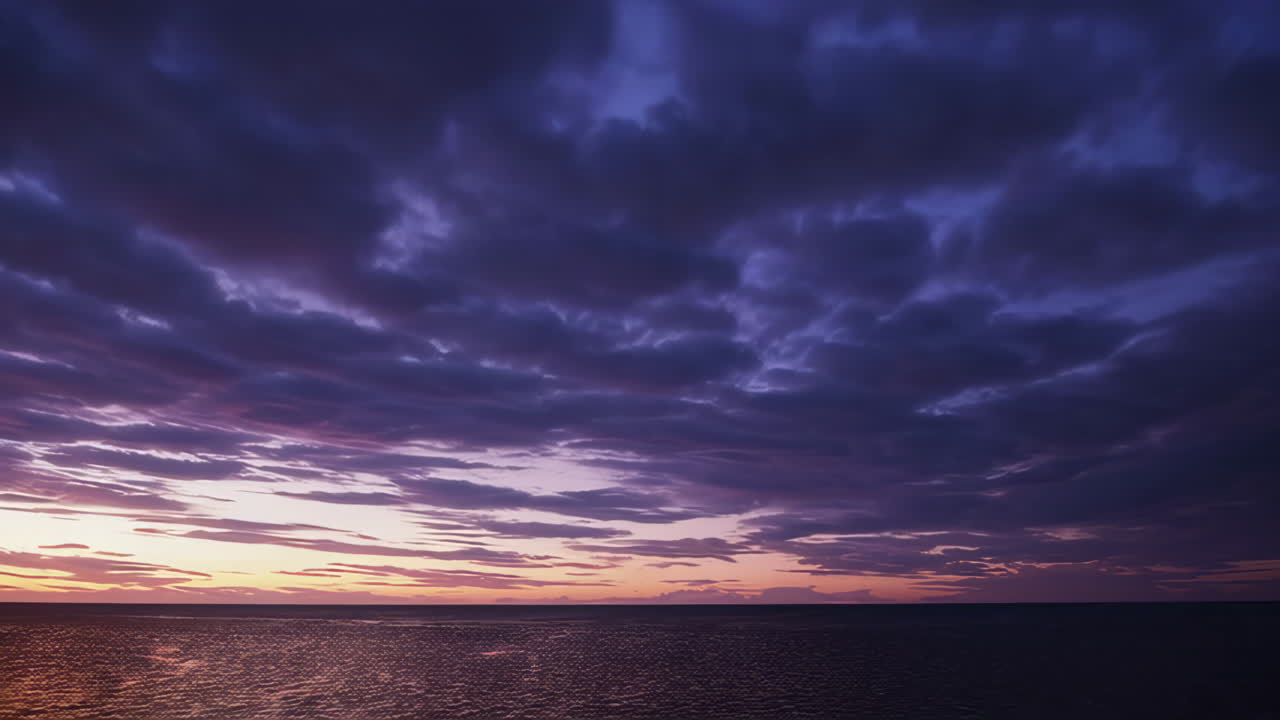 Dramatic Sunset or Sunrise Over the Ocean with Colorful Clouds