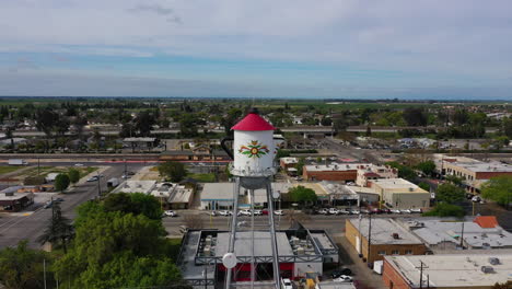 large water tower in san luis california , approaching drone shot