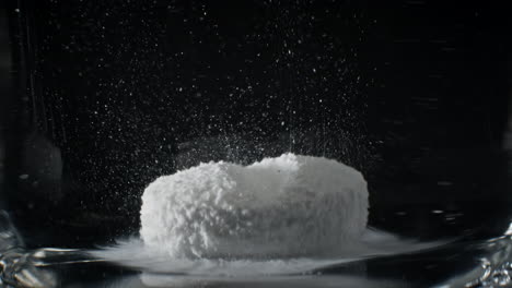 Timelapse-of-White-Medicine-Pill-Capsule-Dissolving-in-Water-like-a-Decomposing-Drug-Capsule-in-Stomach-and-Instestines