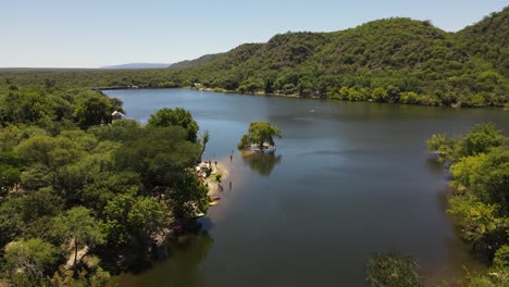 aerial view of natural lake showing group kayaks ready for paddling in nature scenery of argentina during summer