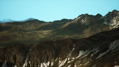 a view of a mountain range with snow on it