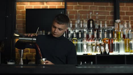 bartender preparing cocktails at a bar