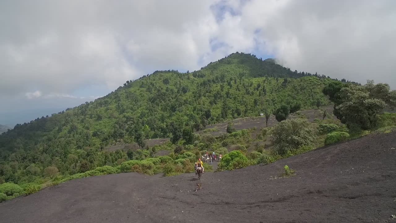 An aerial over hikers trekking on the volcano at Pacaya volcano Guatemala