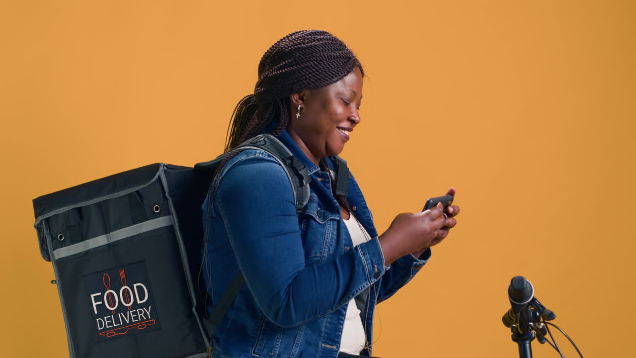 Female Exploring Smartphone On Bicycle