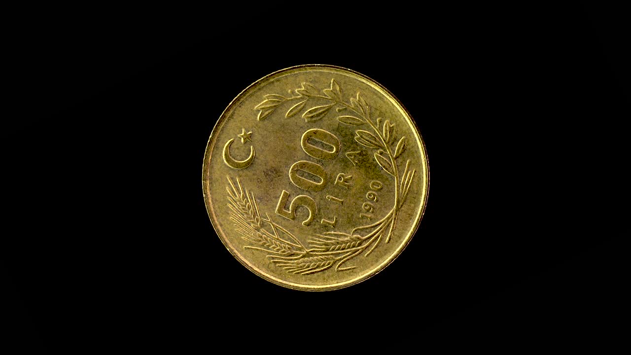 Turkey 1990 500 lira coin reverse with crescent star and wreath rotating on black background