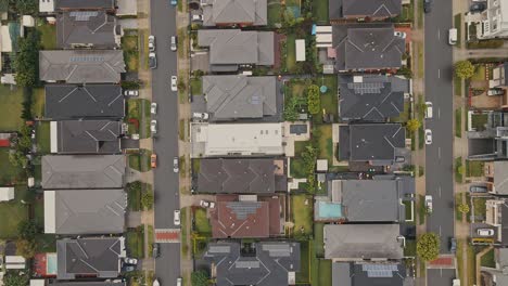 drone of house in sydney,australia,drone,sydney,overhead,road,street,house,block,suburb,cars,neighbourhood,late evening,horizon,sunset,floods