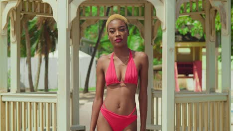 a black woman in a red bikini finds bliss on a caribbean beach with its powdery white sand