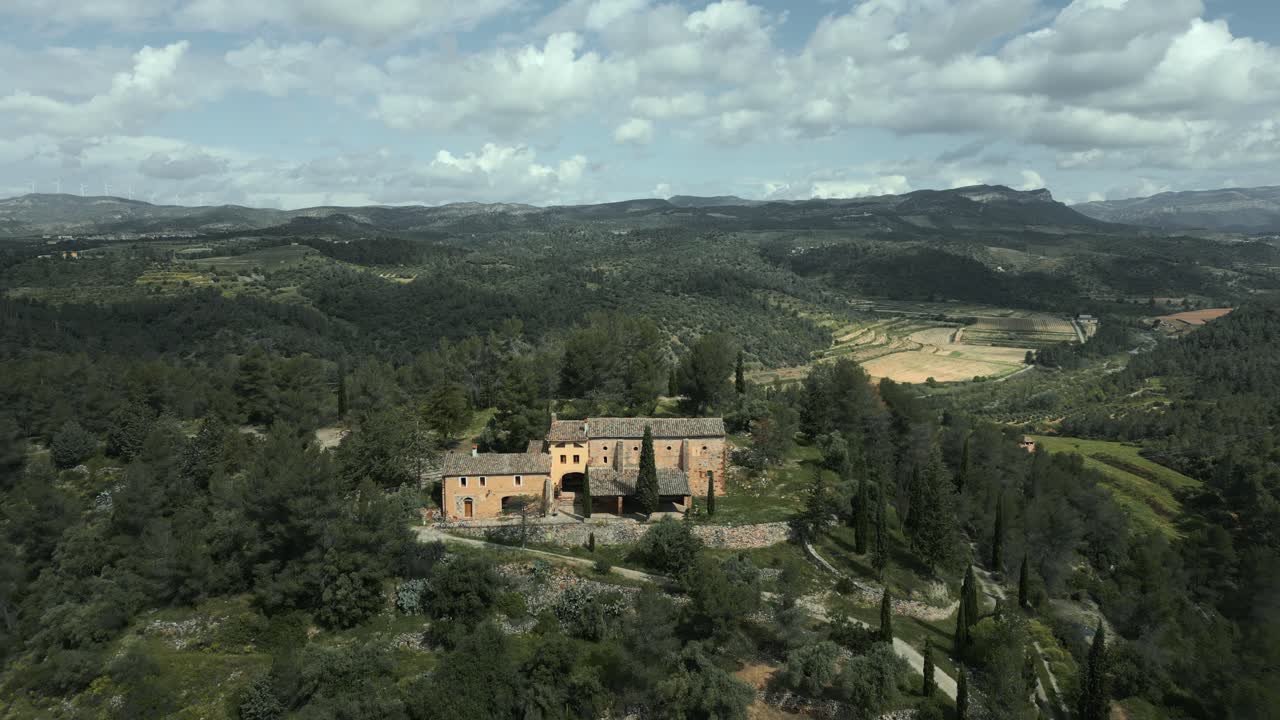 Picturesque views of the catalan hermitage of mare de deu de pinyeres nestled in the serene landscape of el priorat, catalonia, showcasing the tranquility and beauty of the region
