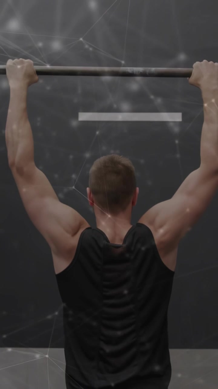 Vertical video: Man gripping bar and pulling up lowering repeating for fitness overlay behind him