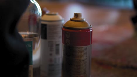 Spray paint bottles from blurry to focus