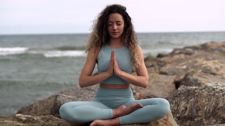 Yogi latino performing indian namaste in peace at Barcelona