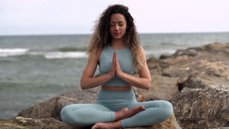 yogi latino performing indian namaste in peace at barcelona