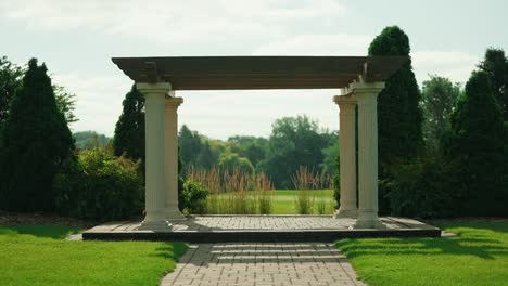 outdoor patio with cement pillars outside on a golf course