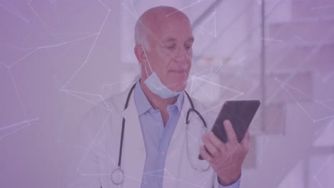 animation of shapes over caucasian male doctor using smartphone