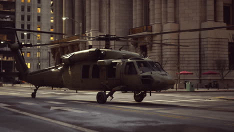 military helicopter landing in a city street