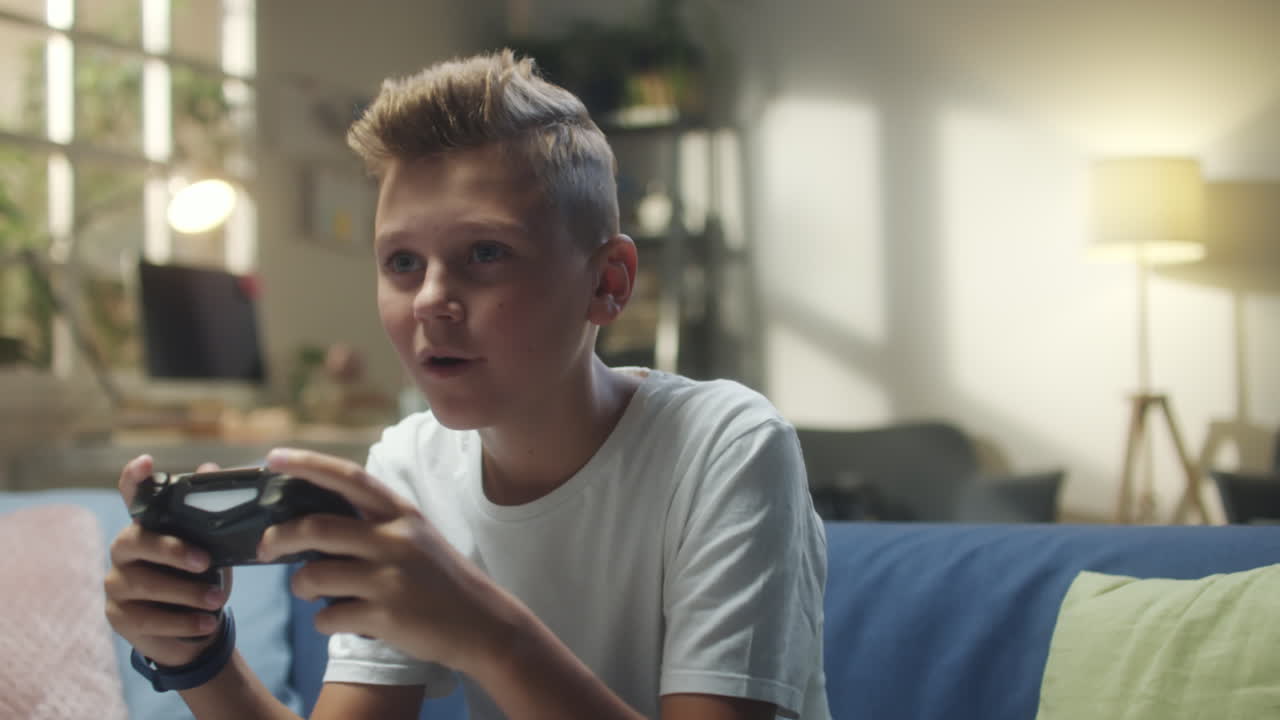 Young Boy Playing Video Games at Home