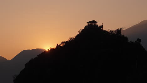 sunrise/sunset view from mountaintop with building