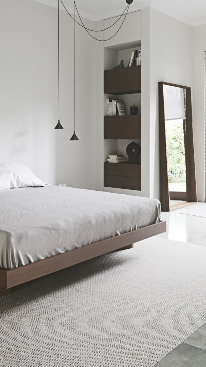 Design semplice di una camera da letto con mobili moderni e layout dello spazio pulito