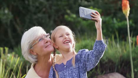 happy little girl taking selfie with grandmother 4k 4k