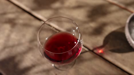 swirling red wine in a glass