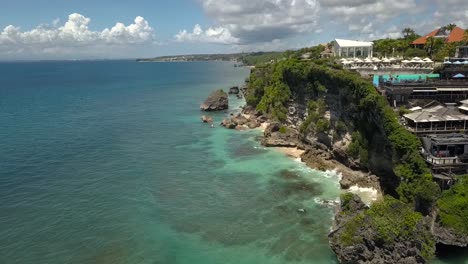 Aerial-Drone-Shot-of-a-Beach-in-Bali-with-cloud-skyline