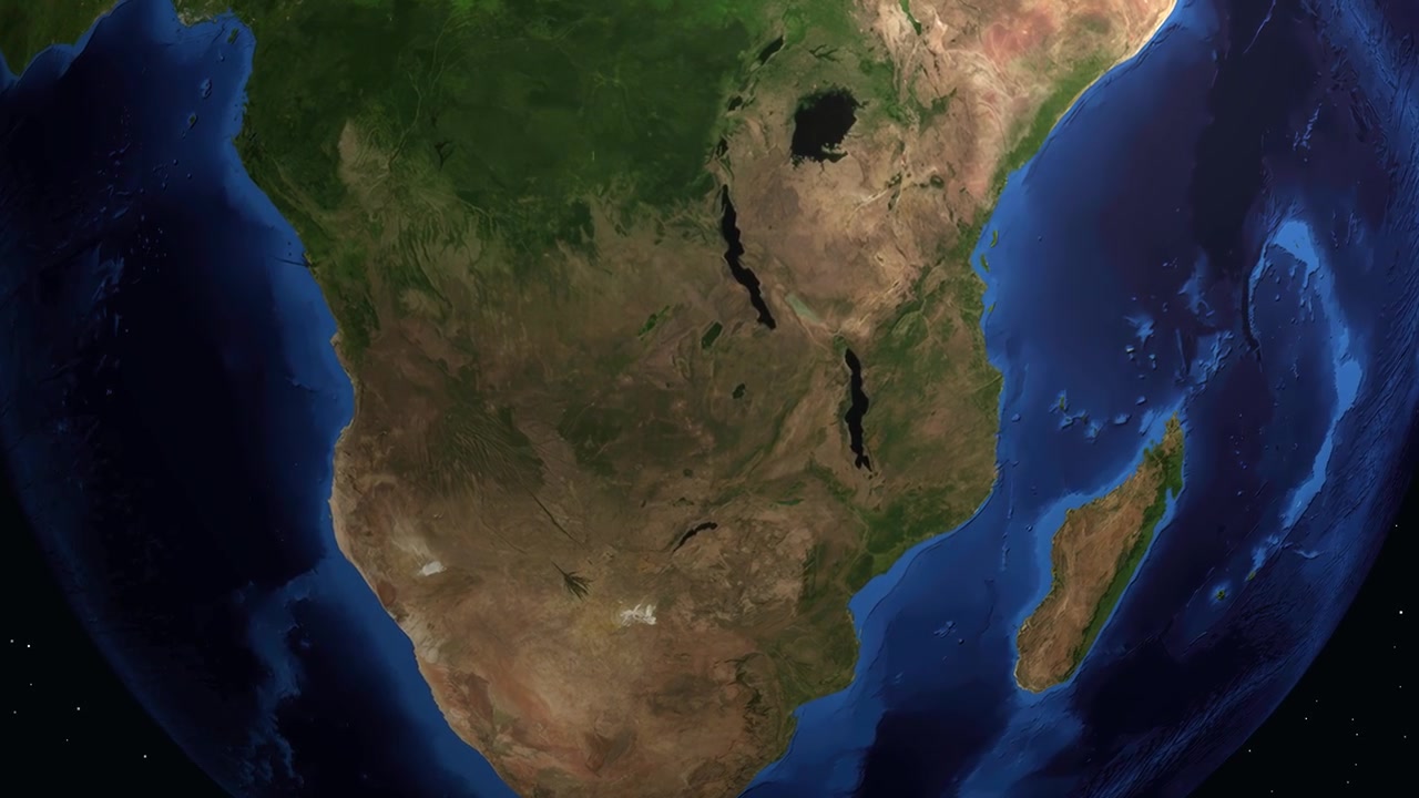 Un'animazione digitale zooma dallo spazio su Lubumbashi, Congo, evidenziando la città con del testo