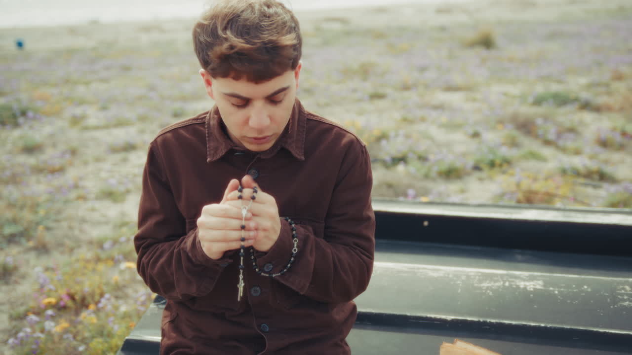 Intense Moment Of Prayer For A Christian Man On The Beach