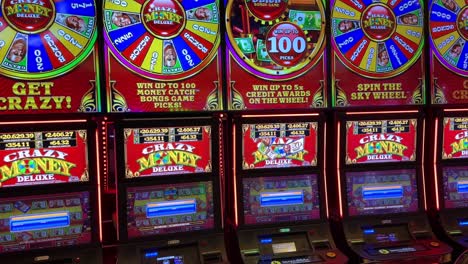 casino wheel of fortune slot machine colorful flashing lights, tilting up view