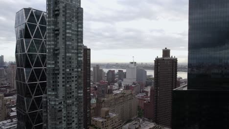 aerial view flying in middle of high-rise in midtown, nyc, usa - reverse, drone shot
