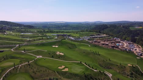 aerial drone view of golf course kacov in czech republic, high panoramic shot, sunny day and green grass