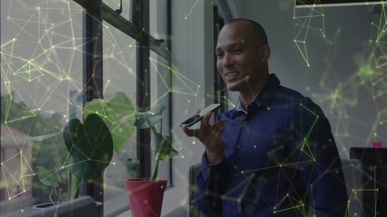 Animation of connections and data processing over biracial businessman using phone in office