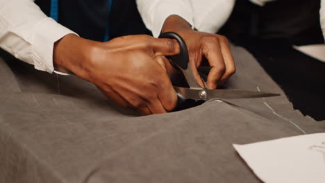 team of tailors cutting material