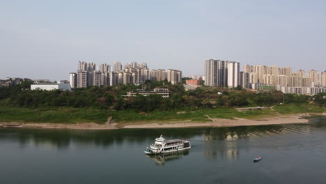 a yacht full of tourists is driving on the river